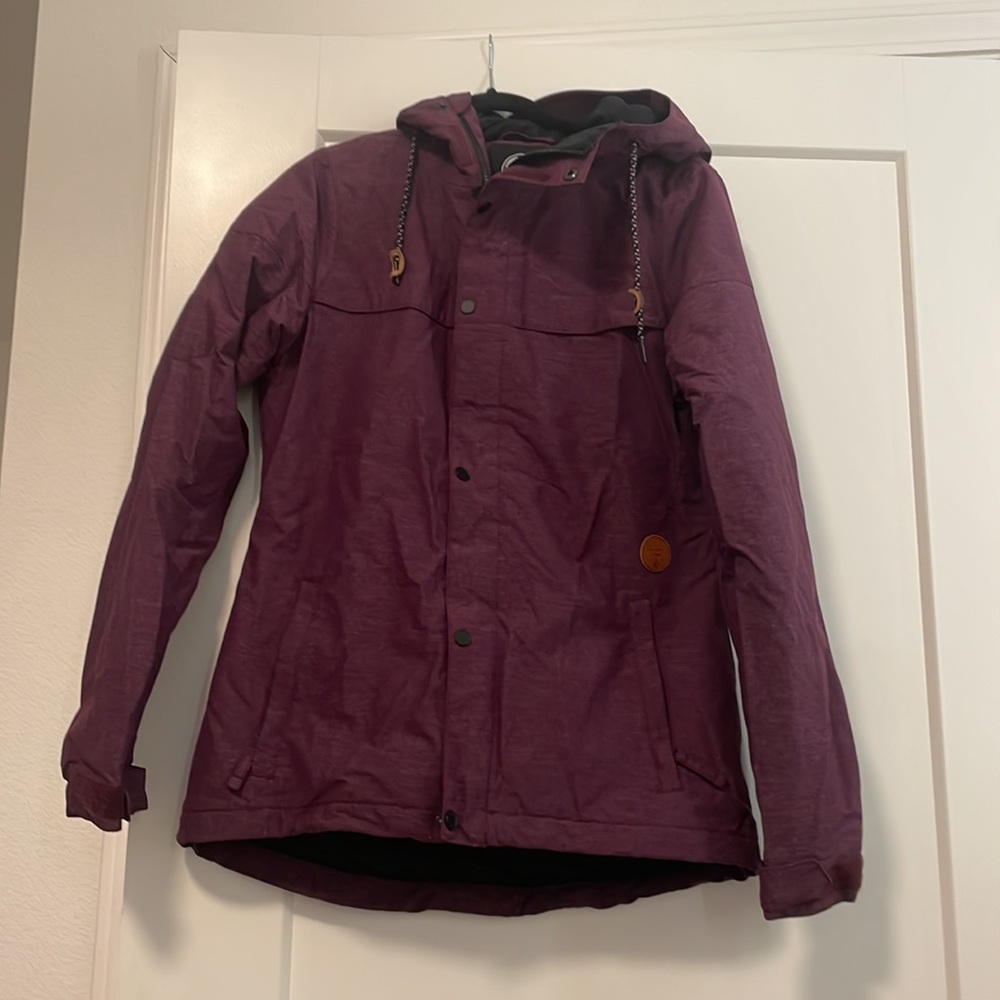 Volcom size medium snow jacket- worn twice- works great! No flaws